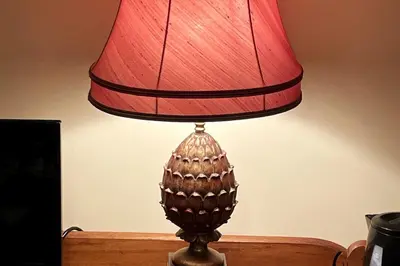 a brown lamp with a red shade on a table at Lower Buckton Country Living Big House near Ludlow 6 bedrooms sleep 12 in Leintwardine
