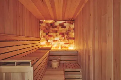 a sauna with a stone wall and a wooden floor at Upper Tumble Cottage in Montgomery