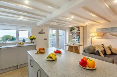 a kitchen with a counter with fruits and vegetables on it at 2 Bed in Llanfair oc-a30451 in Llanfair