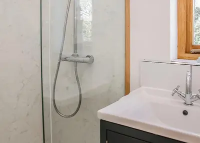 a bathroom with a shower and a sink at Acksea Lodges in Oswestry