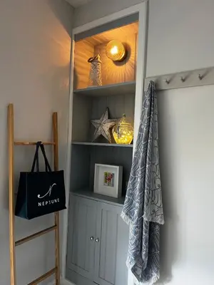 a room with a shelf with a mirror at Nant Llys - Spectacularly placed with sea views in New Quay