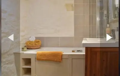 a bathroom with a sink and a bath tub at Glovers cottage private hot tub and super king in Llanrhystyd