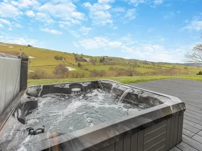 a hot tub on top of a roof at Root - Uk47733 in Mochdre