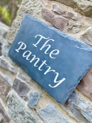 a sign on a brick wall that reads the prank at The Pantry in Erwood