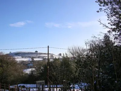 a view of a snow covered hill in the distance at Stiper View Barn 1 in Shrewsbury
