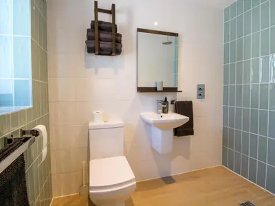 a bathroom with a toilet and a sink at Stiper View Barn 1 in Shrewsbury