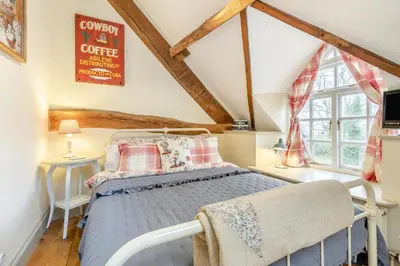 a bedroom with a bed and a window at 6 Bed in Llanfilo oc-e30630 in Llandefalle