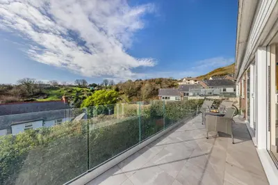 a balcony with a view of a house at 2 Bed in Aberdovey oc-n30627 in Aberdyfi
