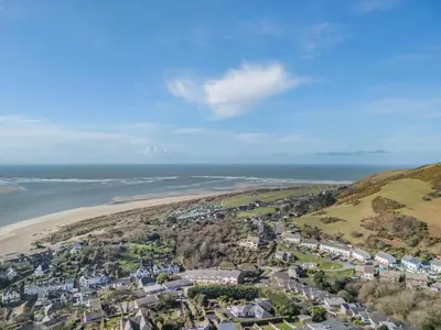 an aerial view of a beach with houses and the ocean at 2 Bed in Aberdovey oc-n30627 in Aberdyfi