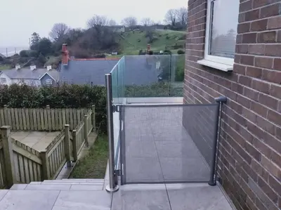 a glass gate on a house with a window at 2 Bed in Aberdovey oc-n30627 in Aberdyfi