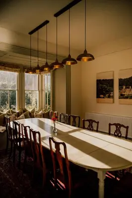 a dining room with a large table and chairs at Wilde Lodge by Birch Stays in Bucknell