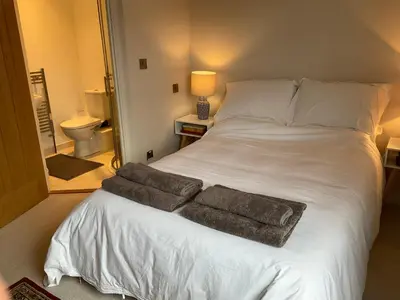a bedroom with a bed with two towels on it at Little Hotspur in Shrewsbury