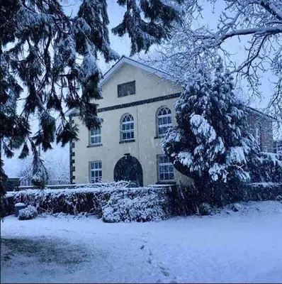 a house covered in snow in front at Old Chapel Llanfrynach in Brecon