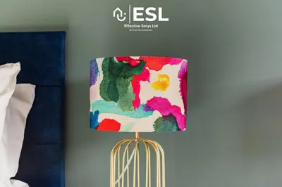 a colorful lamp sitting next to a bed at 4 bedroom house in Shrewsbury with parking in Shrewsbury