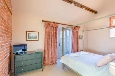 a bedroom with a bed and a tv at 2 Bed in Llangedwyn oc-l30530 in Llangedwyn