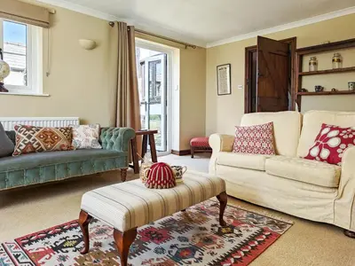 a living room with two couches and a table at 3 Bed in Leominster oc-r30485 in Yarpole