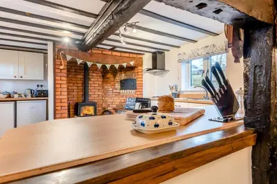 a kitchen with a wooden counter top with a stove at 3 Bed in Leominster oc-r30485 in Yarpole