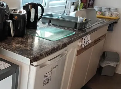 a kitchen counter top with a sink and a sink at Robins nest in Great Hanwood