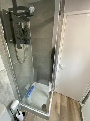 a shower with a glass door in a bathroom at Golygfa'r Orsaf Snowdonia national park, Bala lake in Bala