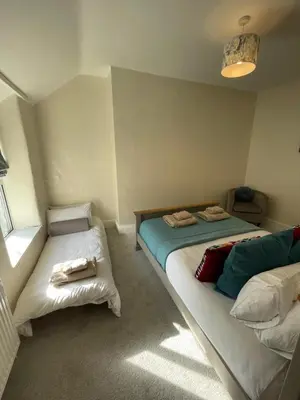a bedroom with two twin beds and a window at Golygfa'r Orsaf Snowdonia national park, Bala lake in Bala