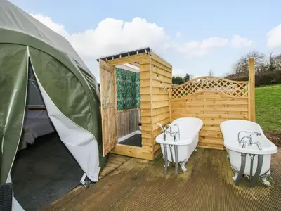 a outdoor bathroom with two sinks and a tub at Meadow View - Bryn-Mawr Retreat in Llanymynech