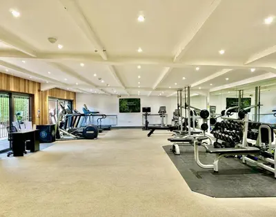 a gym with treadmills and machines in a room at 4 Bed in Llansanffraid oc-p30384 in Llanymynech
