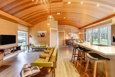 a kitchen and living room with a vaulted ceiling at 4 Bed in Llansanffraid oc-k30383 in Llanymynech