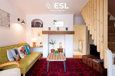 a living room with a couch and a table at 2 Bed Townhouse with Garden & Parking in Shrewsbury