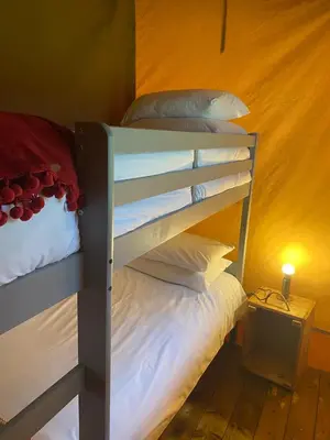 a couple of bunk beds in a room at Cefn Crib Safari Tent in Machynlleth