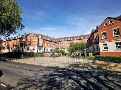 a row of brick buildings on a city street at 1-bedroom apartment Shrewsbury town centre in Shrewsbury