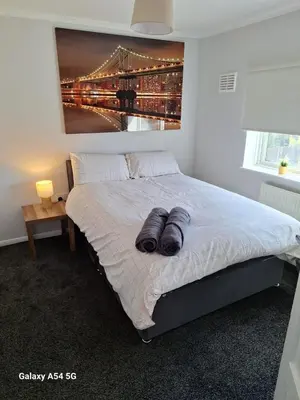 a bedroom with a bed with two pillows on it at Shrewsbury Creations in Shrewsbury