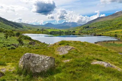a lake in the middle of a grassy field at 1 Bed in Llandderfel oc-t30475 in Llandderfel