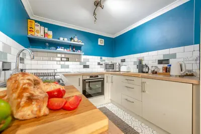 a kitchen with a counter with vegetables on a table at 1 Bed in Drefach oc-m30848 in Llanwenog