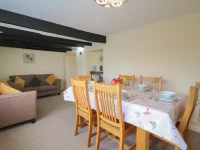 a dining room with a table and chairs at The Firs in Shrewsbury