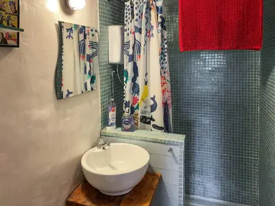 a bathroom with a sink and a shower at Y Smithy - Uk49022 in Llanybydder