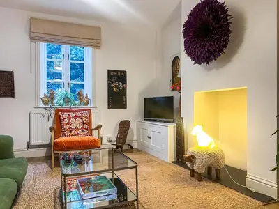 a living room with a couch and a tv at Cosy Cwtch in Hay-on-Wye