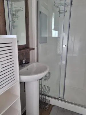 a bathroom with a sink and a shower at Willerby Malton in Barmouth