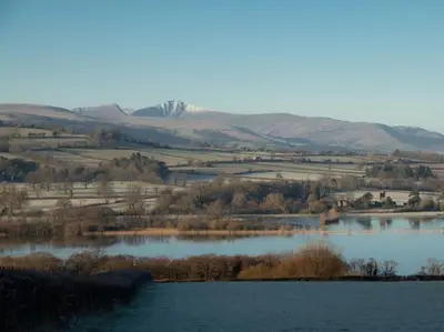 a large body of water with mountains in the background at 2 Bed in Llangorse oc-t30290 in Llangorse