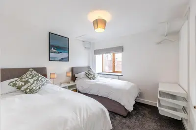 a bedroom with two beds and a window at 2 Bed in Rhoslefain oc-i30763 in Llangelynin