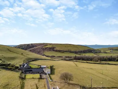 an aerial view of a farm in a field at 2 Bed in Rhoslefain oc-i30763 in Llangelynin