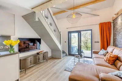 a living room with a couch and a tv at 1 Bed in Berriew oc-a31113 in Berriew