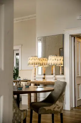 a dining room with a table and two chairs at Sweeney Hall Hotel in Oswestry