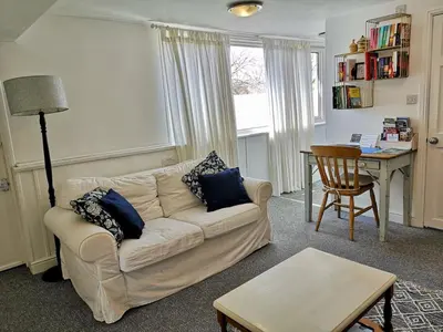 a living room with a couch and a table at The Loft - Shrewsbury in Shrewsbury