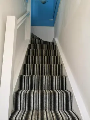 a staircase with a carpeted stair case in a house at The Loft - Shrewsbury in Shrewsbury