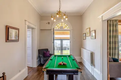 a living room with a pool table at 5 Bed in Hundred House oc-l31090 in Hundred House