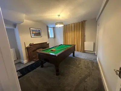 a room with a pool table in a room at Cil-y-Coed in Dolgellau