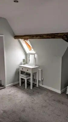 a attic room with a desk and a window at Tyn-Y-Berth Sleeps 27 luxury group accommodation in Tal-y-llyn