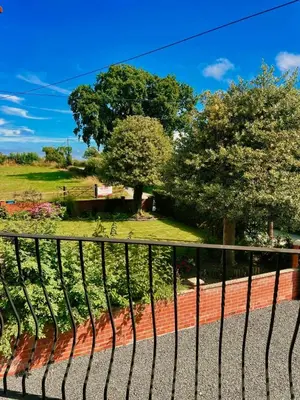 a view of a park from a fence at The Old Smithy, beautifully restored cottage in Carreghofa, near Llanymynech in Llanymynech