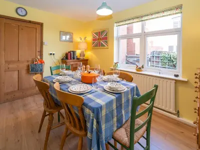 a dining room with a table and chairs at Quintessentially English 3-Bed Home in Ludlow - Pass the Keys in Ludlow