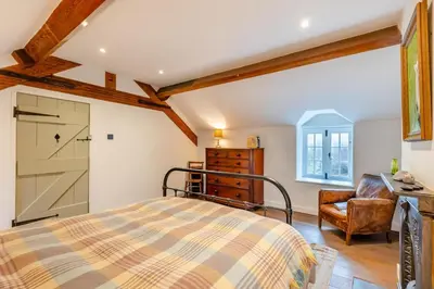 a bedroom with a bed and a desk and a chair at 4 Bed in Llangower oc-f31072 in Llangower